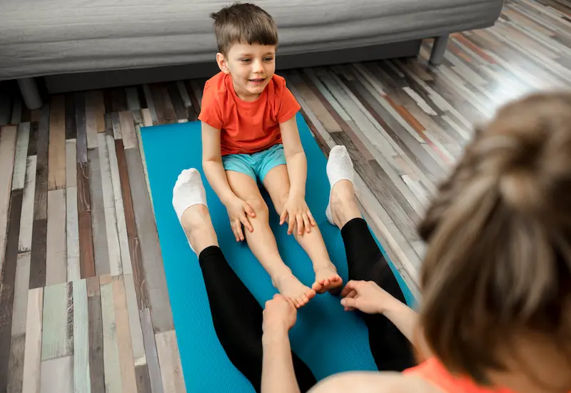 cute-little-boy-training-with-mother-home