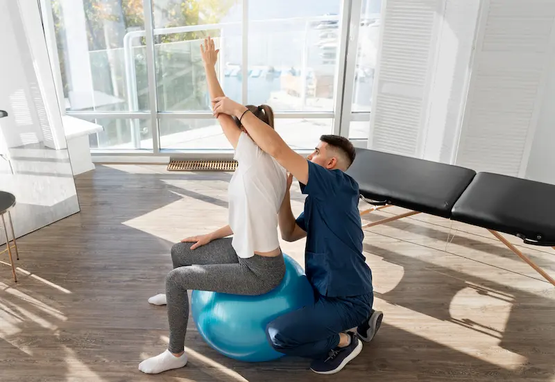 full-shot-woman-exercising-gym-ball