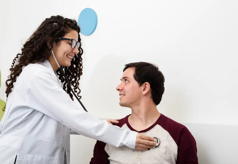 side-view-smiley-doctor-checking-patient